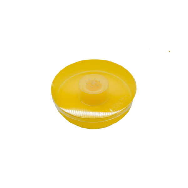 Disque jaune en plastique translucide avec couvercle et punctiforme au centre.