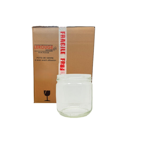 Boîte en carton scellée et pot en verre transparent devant.