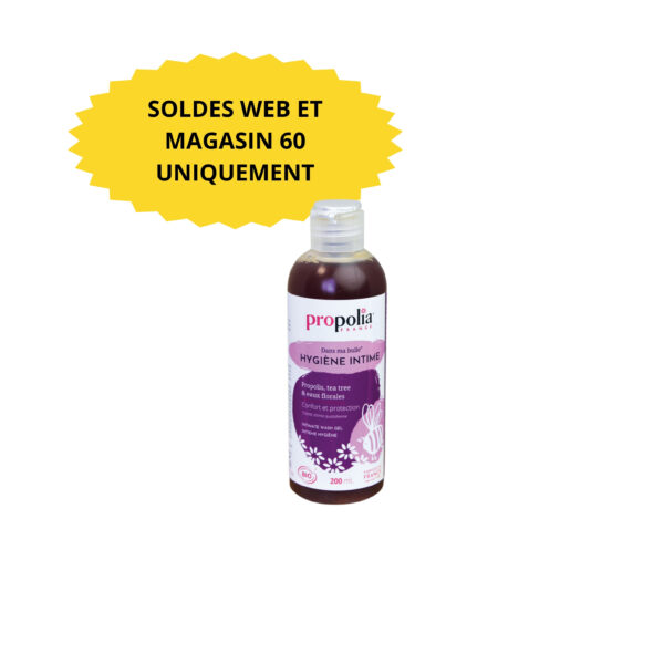 Bouteille de gel douche intime partiellement visible sur fond blanc, étiquette rose et violette.