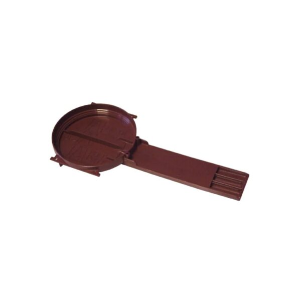 Partie d’un objet plastique brun, rond et cylindrique avec un long élément rectiligne attaché.